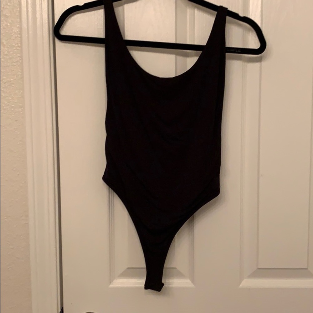 Black naked wardrobe body suit. Low in back